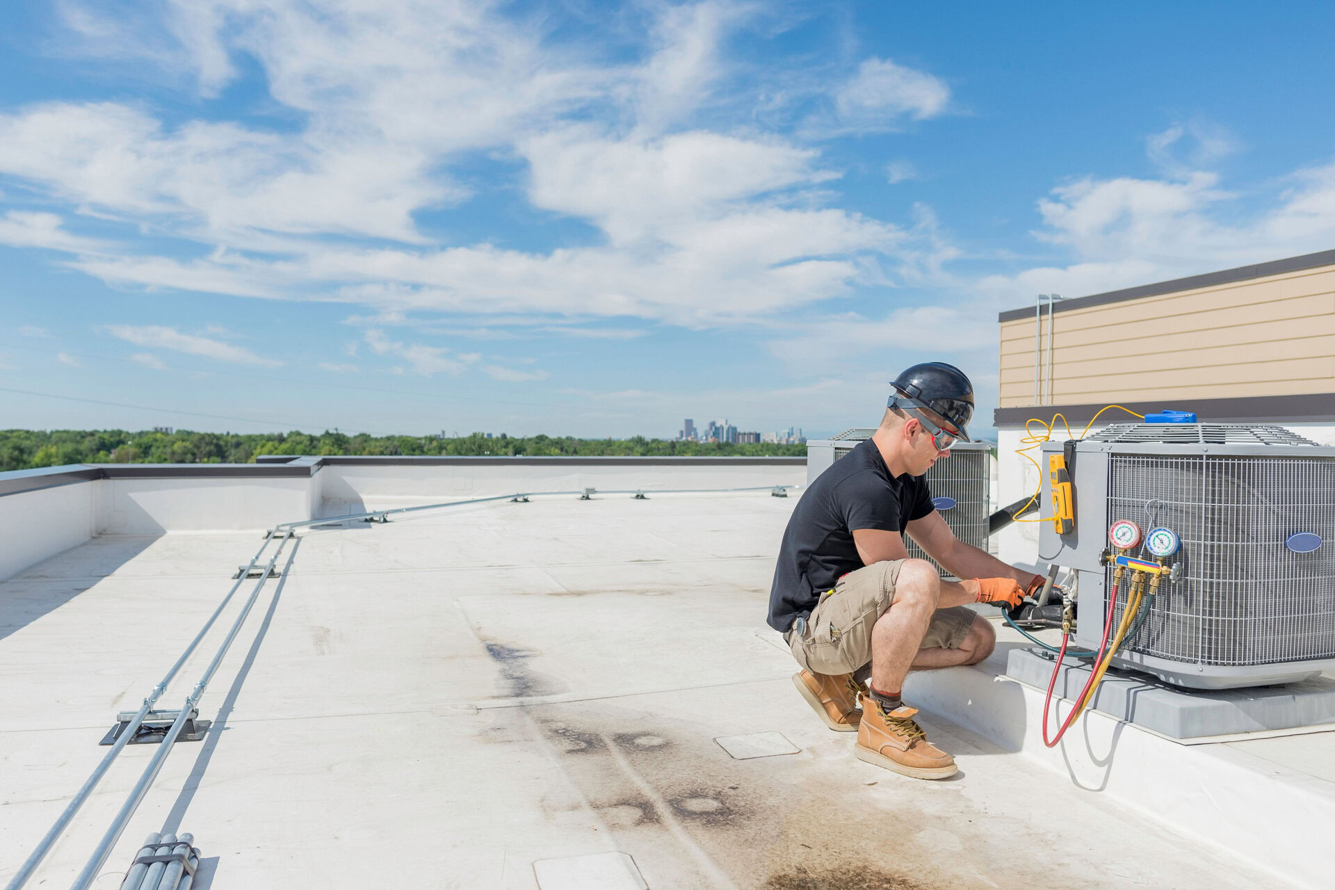 HVAC technician servicing an outdoor air conditioning system